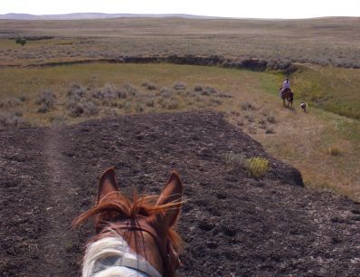 Arrow looking down at Marna riding Missy